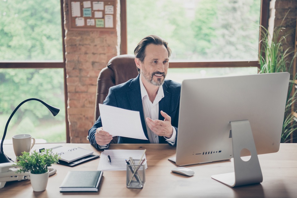 Portrait of his he nice handsome cheerful man specialist online appointment planning project start-up insurance sales global organization at modern loft brick industrial workplace workstation